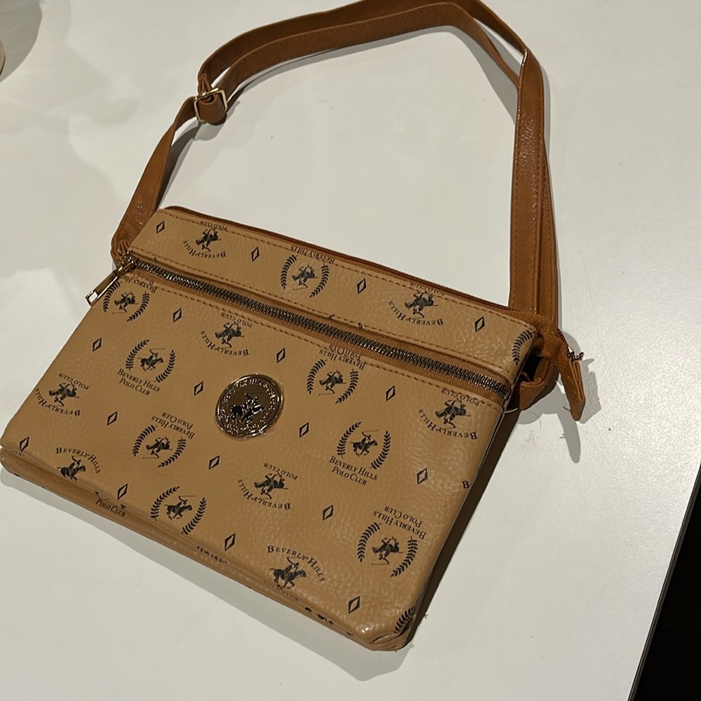 Tan crossbody/shoulder bag. I have only 1, this style. 2 Compartment in & 1 out